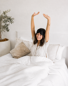 Woman waking comfortably with the RestingBelly Sleep Mask